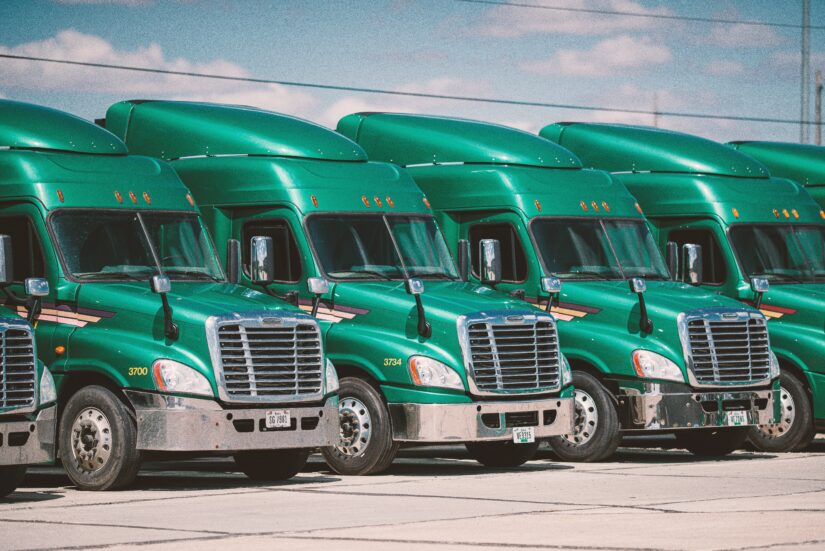 Photo of green colored trucks 