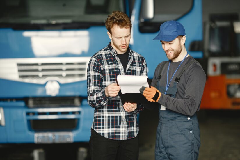 Photo of Drivers Checking Document